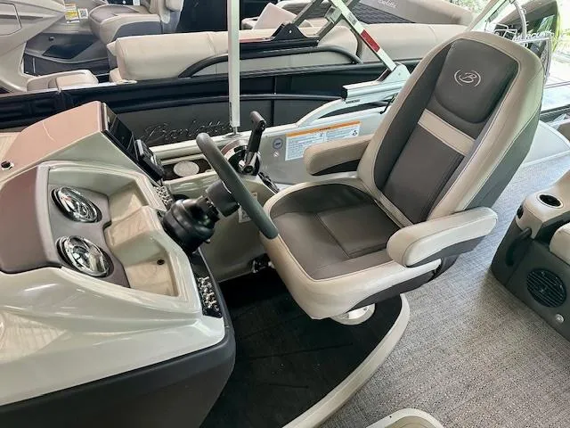 Slide: The Image of 2024 Barletta Cabrio 22UC boat cockpit with captain's chair and control panel. - 3