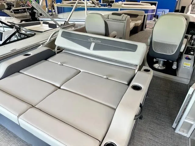 Slide: The Image of 2024 Barletta Cabrio 22UC pontoon boat interior with luxurious seating and modern design. - 6