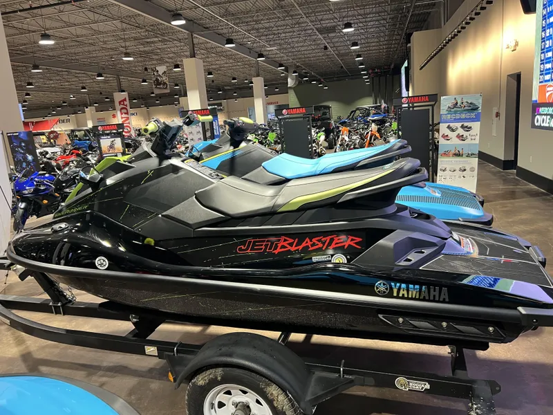 Slide: The Image of 2023 Yamaha WaveRunner JetBlaster on display in a showroom. - 2