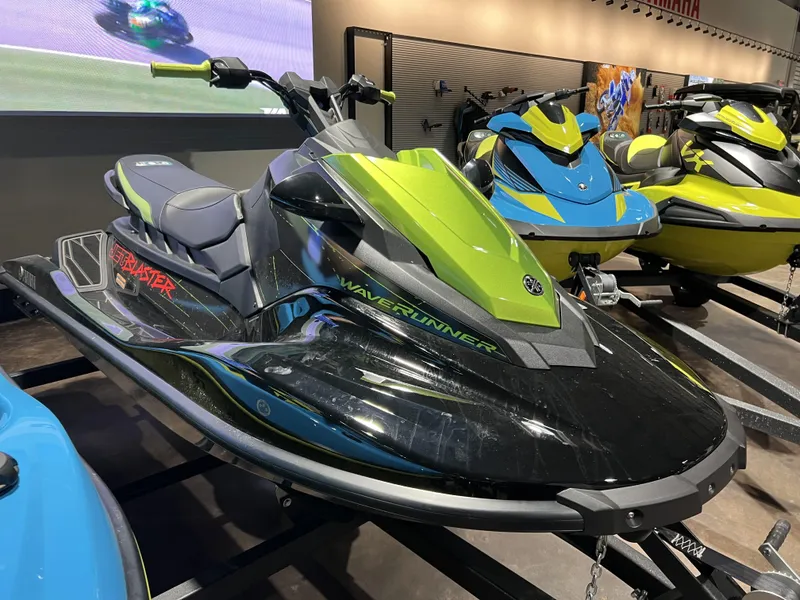 Slide: The Image of 2023 Yamaha WaveRunner JetBlaster in showroom, black and green design. - 4