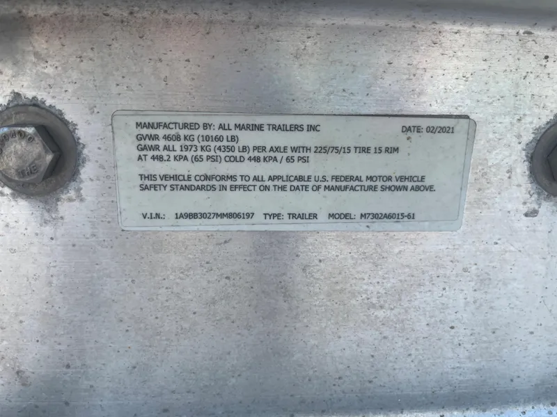 Slide: The Image of 2004 World Cat 270 SF trailer label with specifications and VIN. - 12