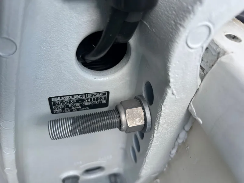 Slide: The Image of Close-up of a 2004 World Cat 270 SF boat's Suzuki DF250 motor mount. - 17