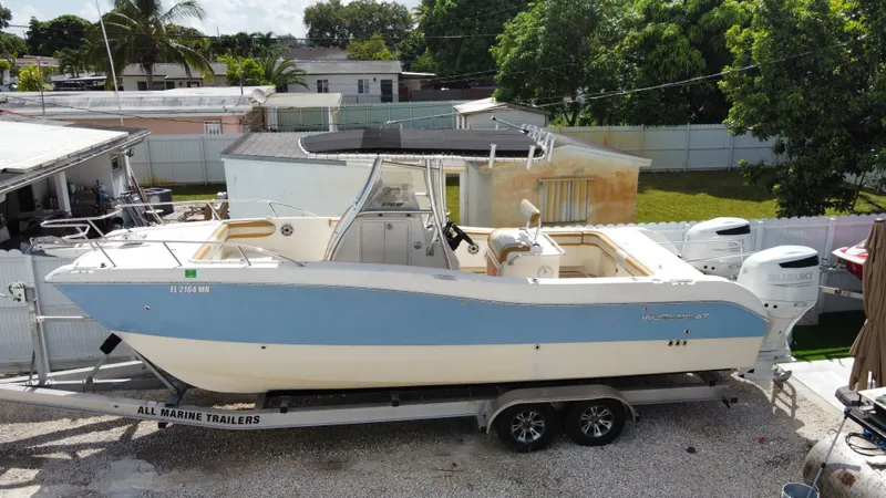 Slide: The Image of 2004 World Cat 270 SF boat on trailer in residential area. - 2