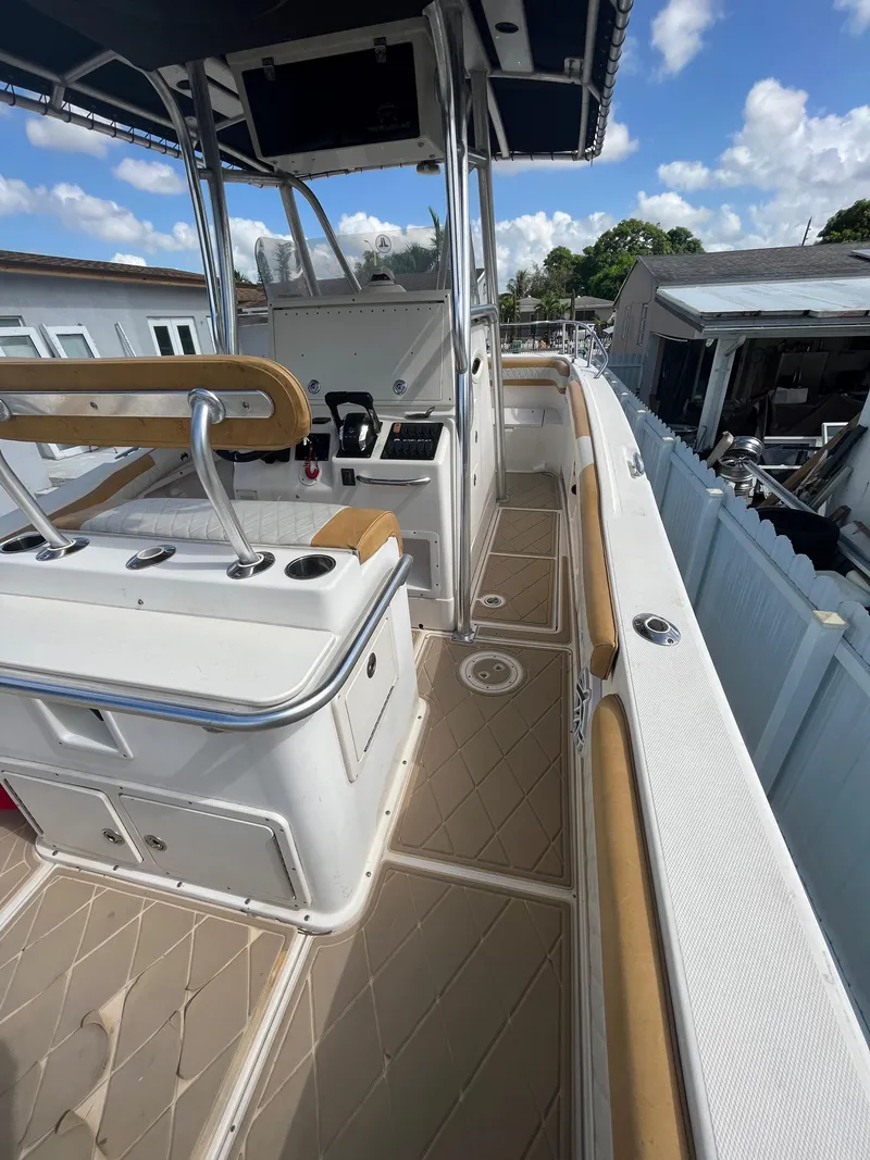 Slide: The Image of 2004 World Cat 270 SF boat deck with helm station and seating. - 23