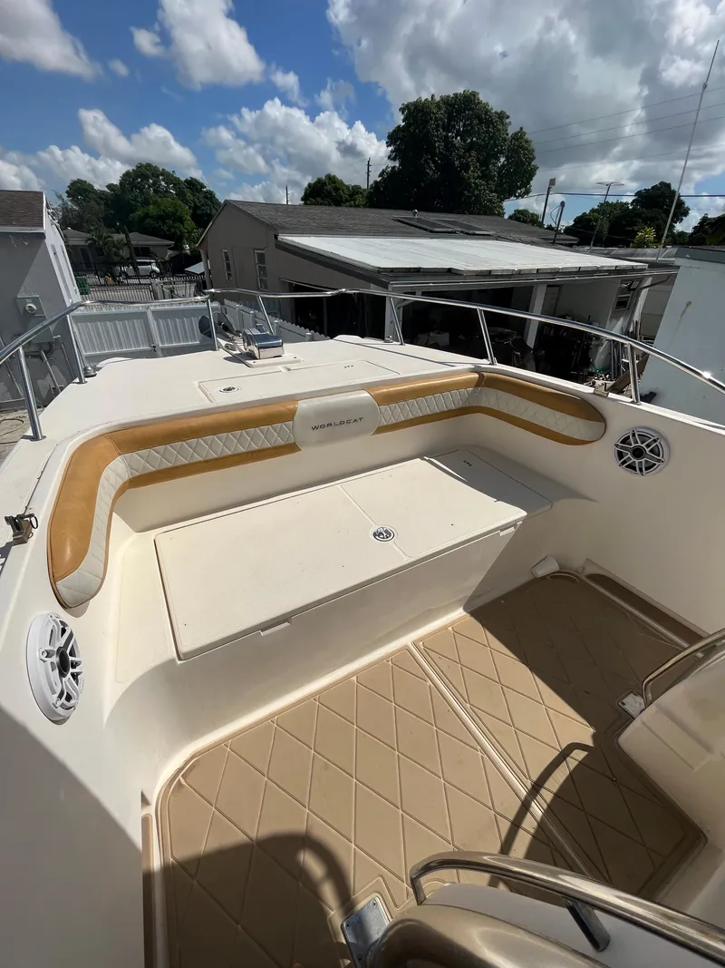 Slide: The Image of 2004 World Cat 270 SF boat deck with cushioned seating and storage. - 35