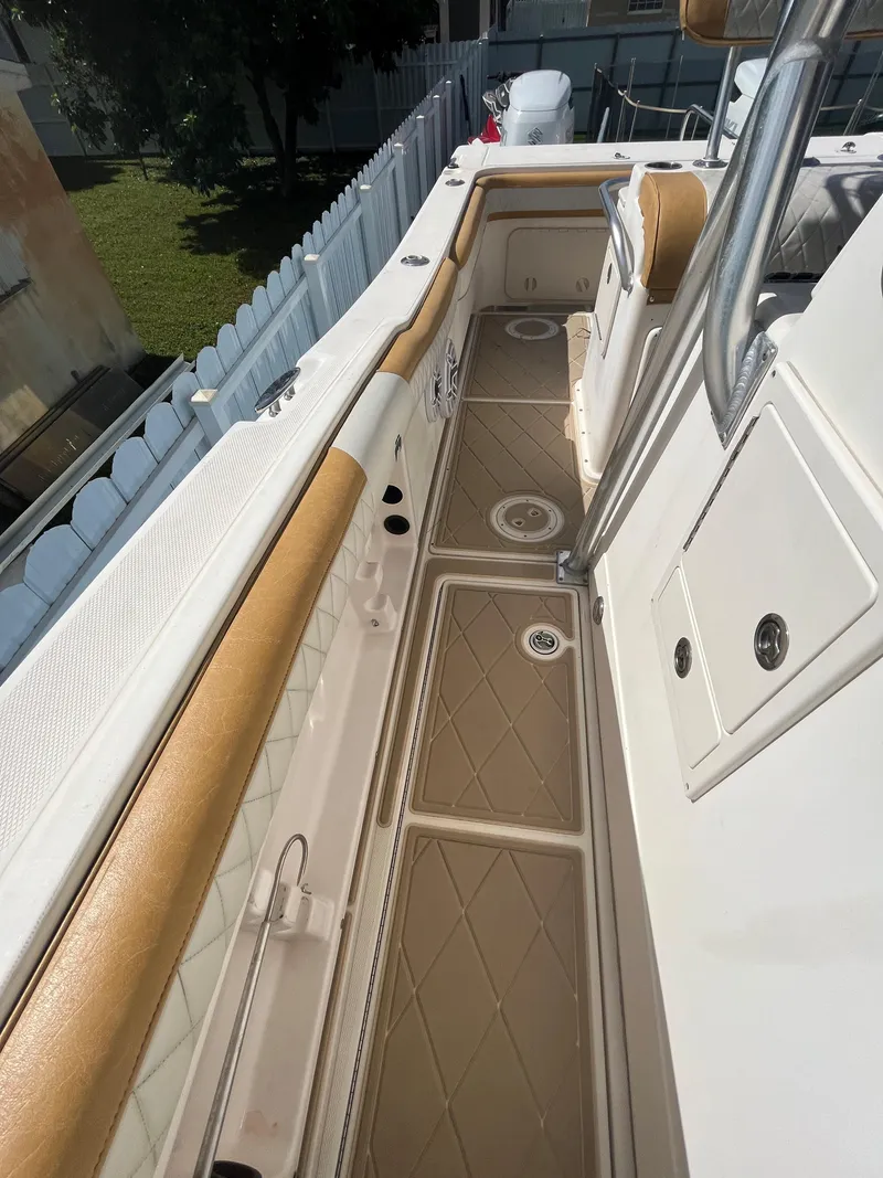 Slide: The Image of 2004 World Cat 270 SF boat deck with tan and white detailing. - 39