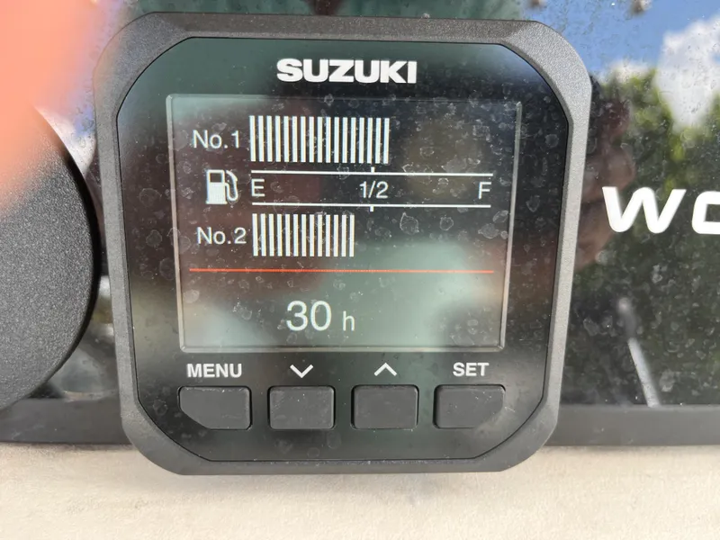 Slide: The Image of Suzuki fuel gauge display on a 2004 World Cat 270 SF boat. - 43