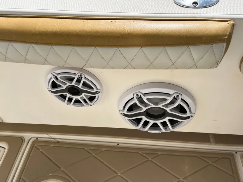 Slide: The Image of 2004 World Cat 270 SF boat interior with dual marine speakers. - 45