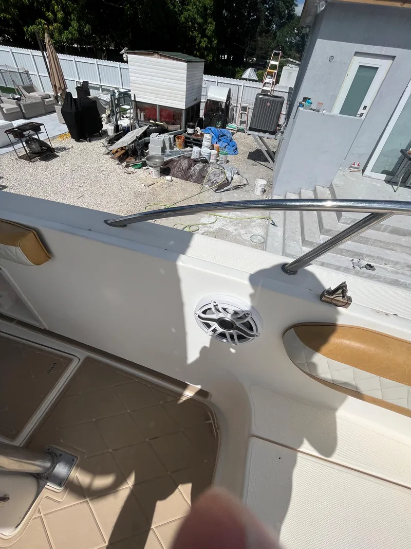 Slide: The Image of 2004 World Cat 270 SF boat interior with outdoor equipment in the background. - 47