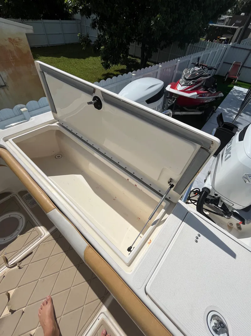 Slide: The Image of Open storage compartment on a 2004 World Cat 270 SF boat. - 49