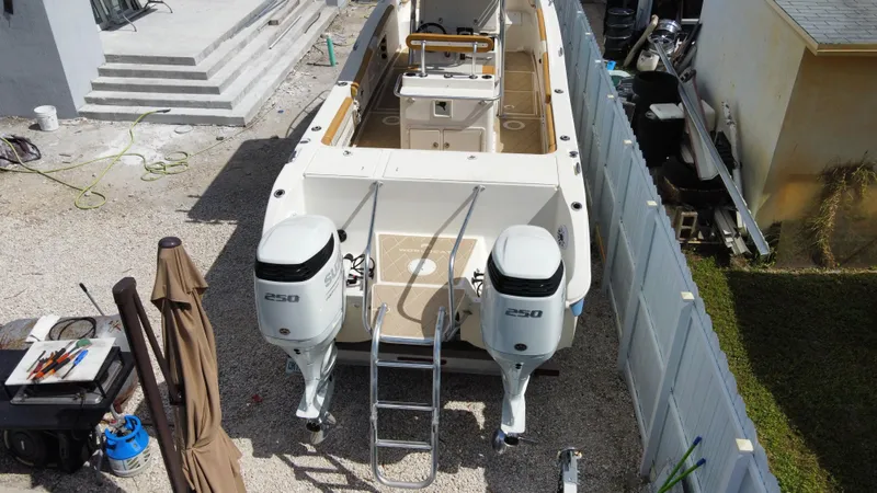 Slide: The Image of 2004 World Cat 270 SF boat with twin outboard engines, aerial view. - 6