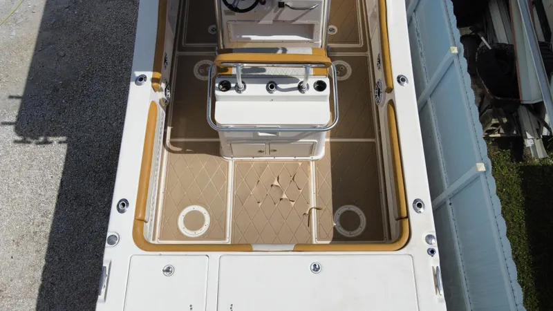 Slide: The Image of 2004 World Cat 270 SF boat deck with center console and rod holders. - 7