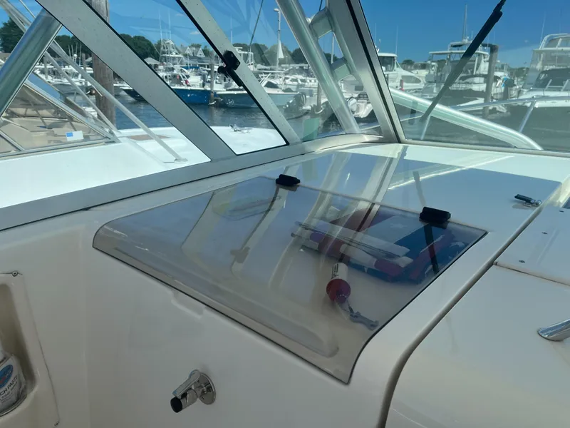 Slide: The Image of 2008 Rampage 30 Express boat dashboard with marina view. - 13