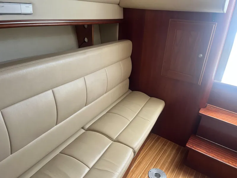 Slide: The Image of 2008 Rampage 30 Express interior with beige leather seating and wooden accents. - 22