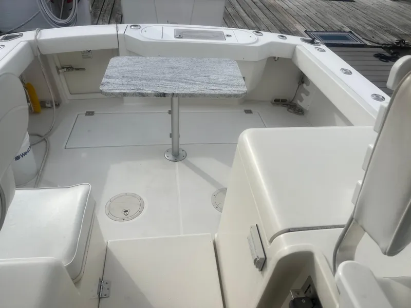 Slide: The Image of 2008 Rampage 30 Express boat interior with seating and table. - 37