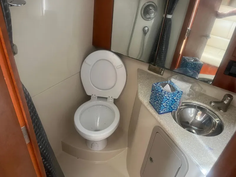 Slide: The Image of 2008 Rampage 30 Express boat bathroom with toilet, sink, and shower. - 41
