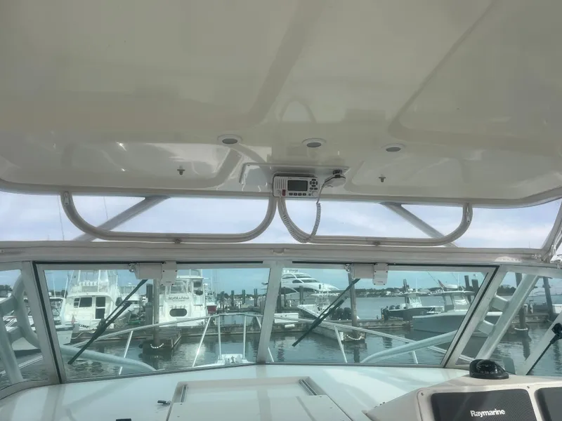 Slide: The Image of 2008 Rampage 30 Express boat interior view at marina. - 43