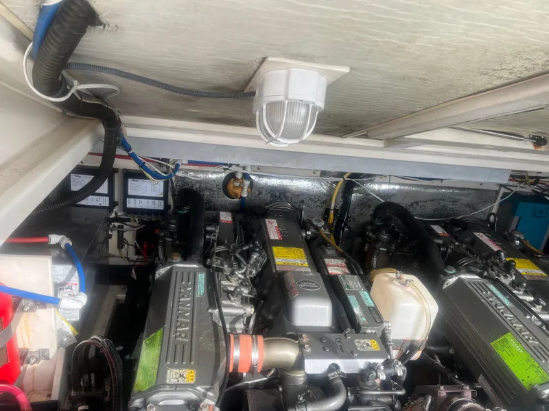 Slide: The Image of Engine room of 2008 Rampage 30 Express boat with dual engines and wiring. - 45