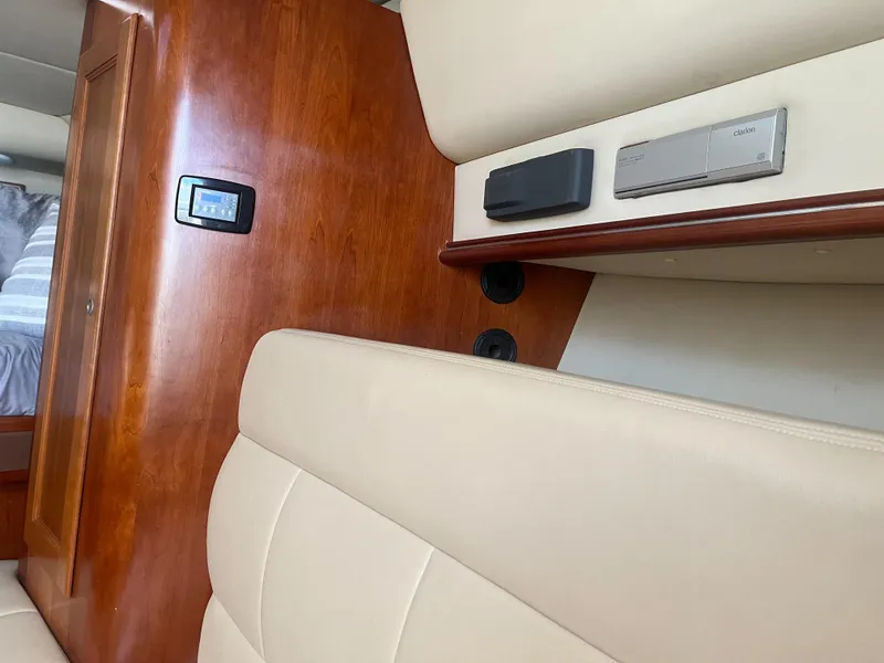 Slide: The Image of Interior of 2008 Rampage 30 Express with beige seating and wood paneling. - 7