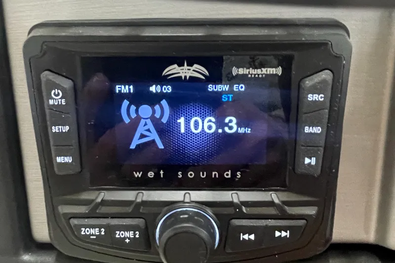 Slide: The Image of Berkshire 22CL CTS 2023 boat stereo system displaying FM radio 106.3 MHz. - 14