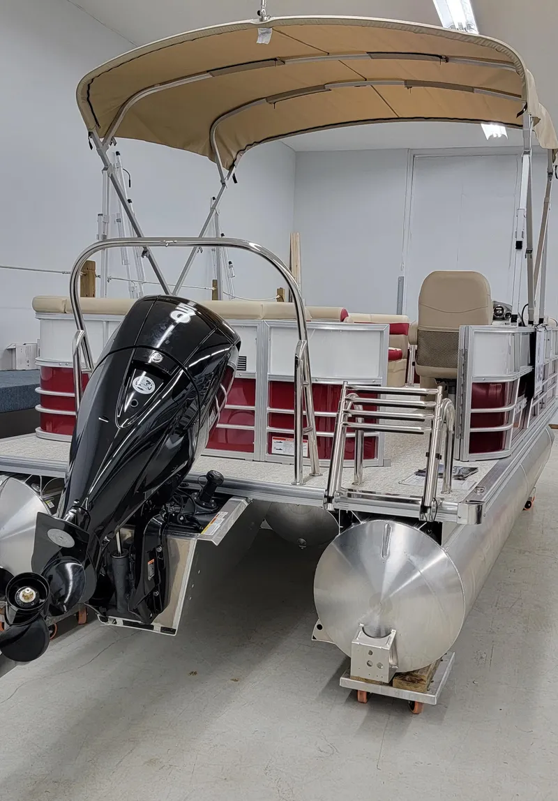 Slide: The Image of 2023 Berkshire 22CL CTS pontoon boat with canopy and outboard motor. - 2