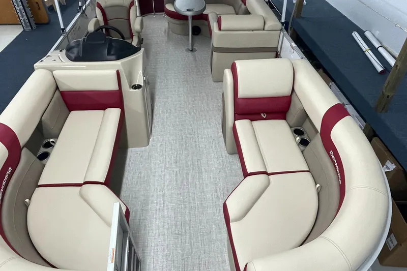 Slide: The Image of 2023 Berkshire 22CL CTS pontoon boat interior with beige and red seating. - 7