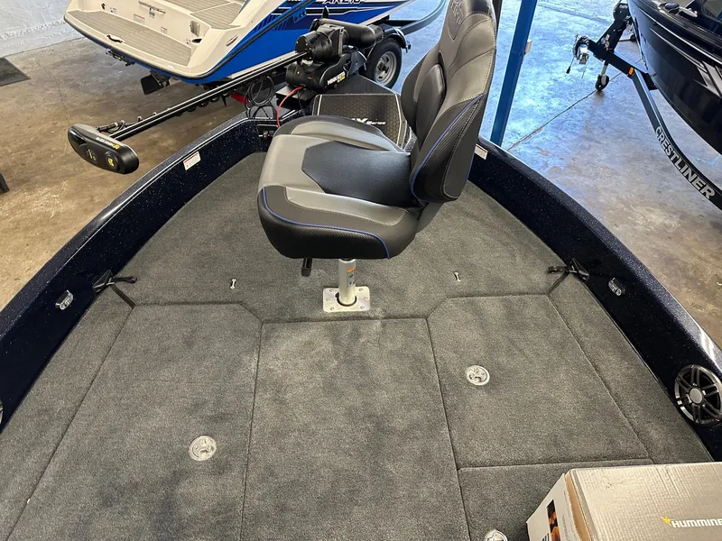 Slide: The Image of 2025 Skeeter WX2200 boat interior with swivel seat and carpeted deck. - 5