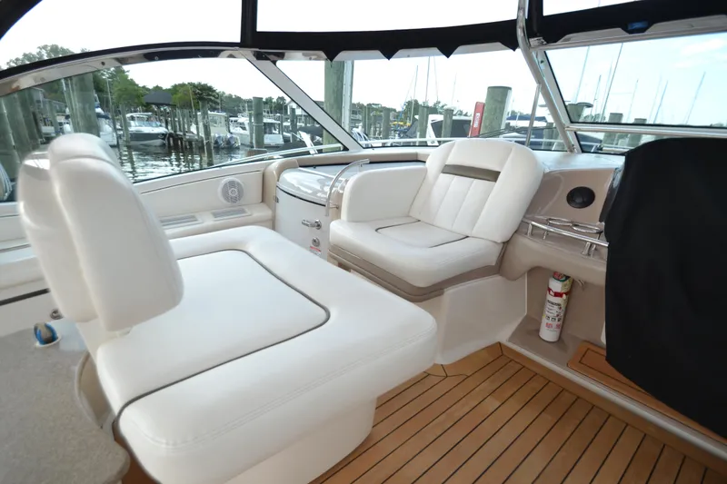 Slide: The Image of Interior of a 2007 Sea Ray 520 Sundancer yacht with white seating. - 11