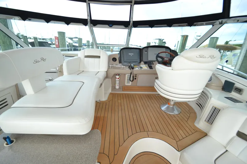 Slide: The Image of Interior of a 2007 Sea Ray 520 Sundancer yacht with luxurious seating. - 12