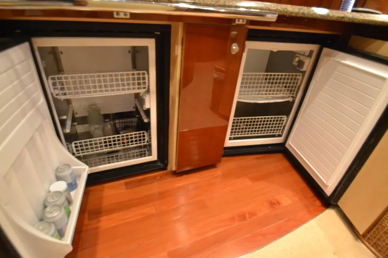 Slide: The Image of 2007 Sea Ray 520 Sundancer kitchen area with refrigerators. - 19