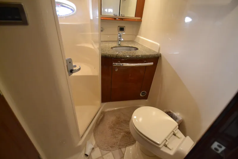 Slide: The Image of Sea Ray 520 Sundancer 2007 bathroom with toilet and sink. - 25