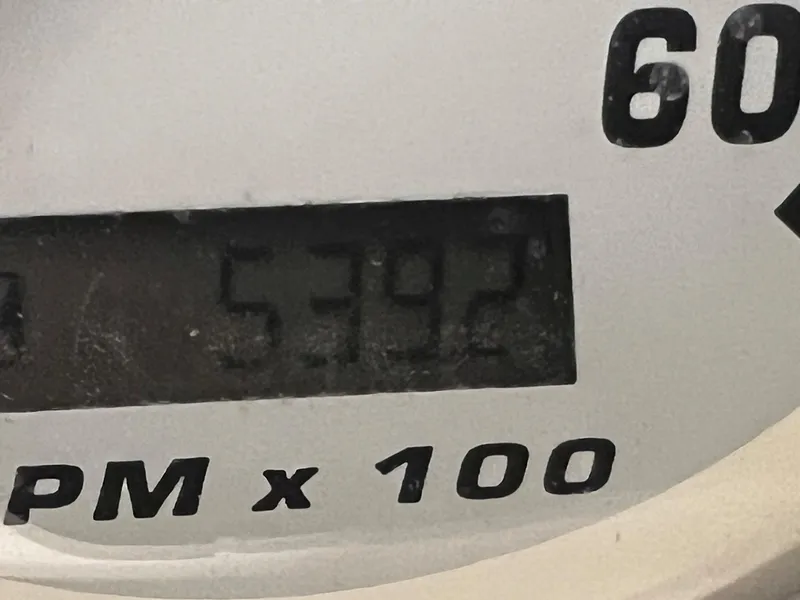 Slide: The Image of Close-up of a 2001 Larson 270 boat tachometer showing 5392 RPM. - 20