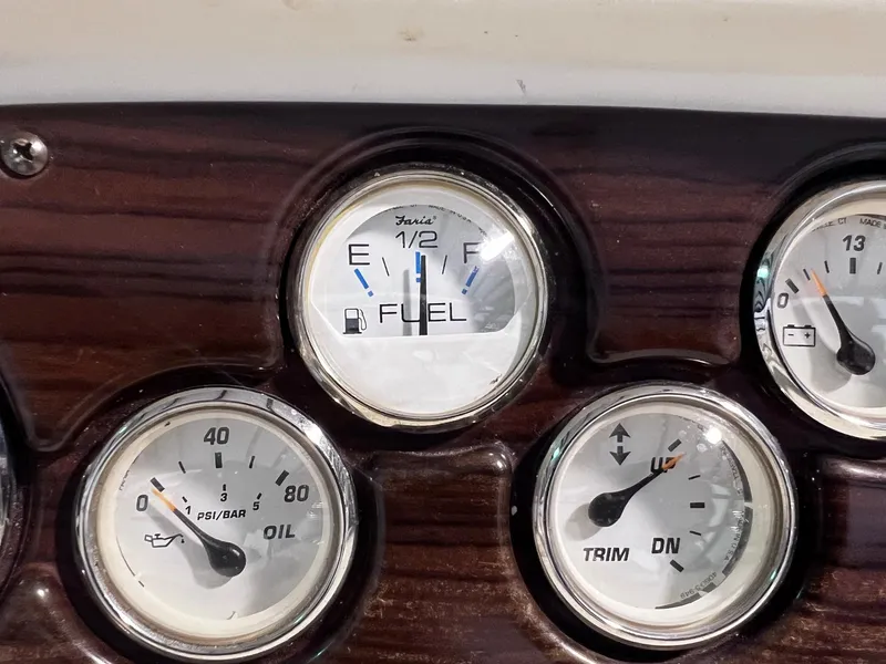 Slide: The Image of Close-up of 2001 Larson 270 boat dashboard gauges. - 22