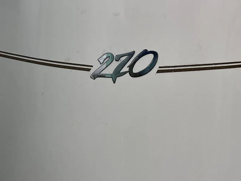 Slide: The Image of 2001 Larson 270 boat model emblem on white background - 23