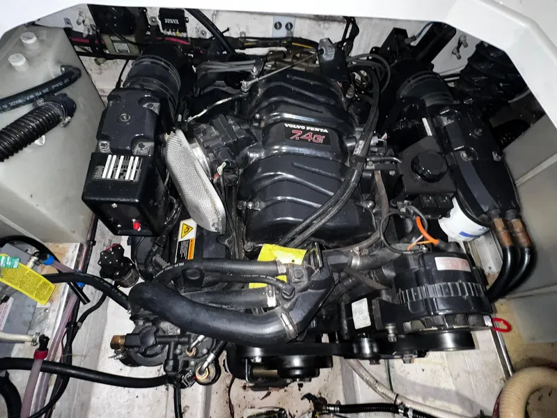 Slide: The Image of 2001 Larson 270 boat engine compartment with Volvo Penta 7.4G engine. - 26