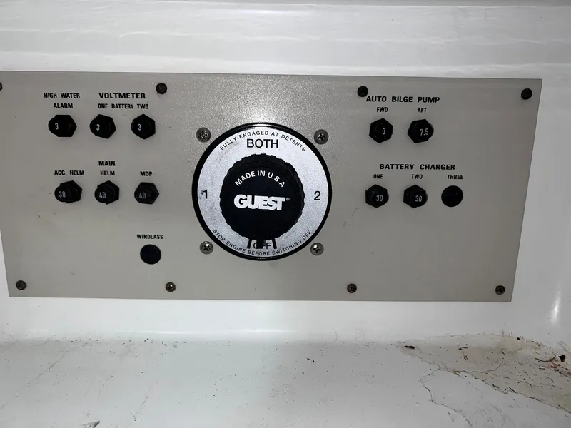 Slide: The Image of Control panel of a 2001 Larson 270 boat with various gauges and switches. - 29