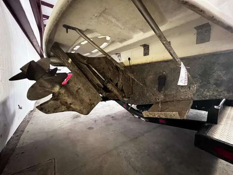 Slide: The Image of 2001 Larson 270 boat propeller and stern drive in storage. - 31