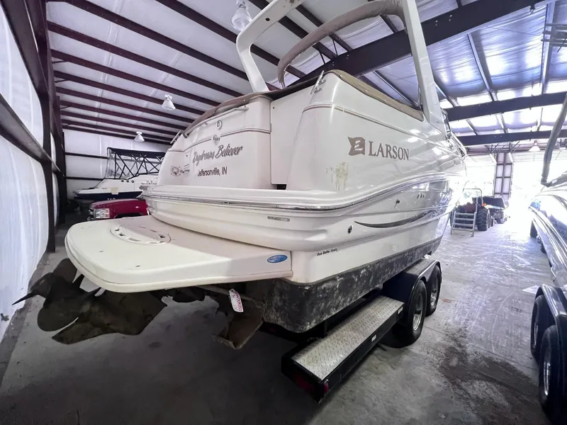 Slide: The Image of 2001 Larson 270 boat on trailer in storage facility. - 4