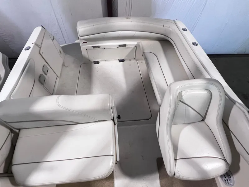 Slide: The Image of 2001 Larson 270 boat interior with white leather seating. - 7