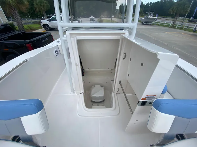 Slide: The Image of 2024 Robalo 202 EXPLORER boat interior with open storage compartment. - 15