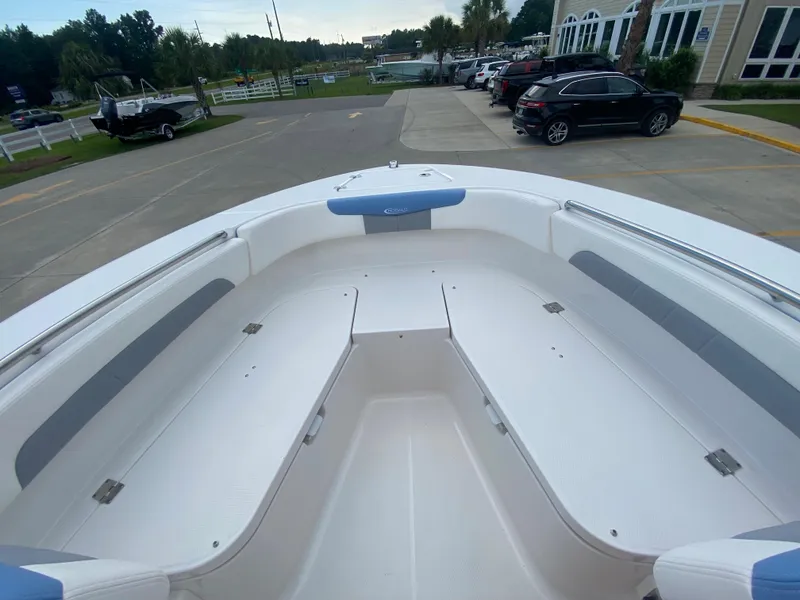 Slide: The Image of 2024 Robalo 202 EXPLORER boat interior, spacious seating and storage compartments. - 18