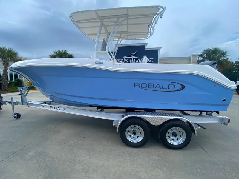 Slide: The Image of 2024 Robalo 202 EXPLORER boat on a trailer, side view. - 0