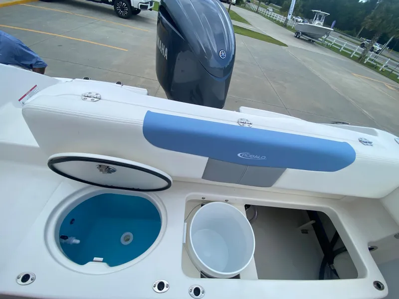Slide: The Image of 2024 Robalo 202 EXPLORER boat interior with Yamaha engine, livewell, and storage compartments. - 9