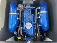 Slide: The Image of 2024 MasterCraft XT22 T boat engine with blue components. - 15