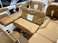 Slide: The Image of 2024 MasterCraft XT22 T boat interior with tan and white seating. - 16