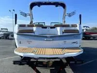 Slide: The Image of 2024 MasterCraft XT22 T boat rear view with swim platform. - 4