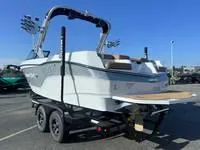 Slide: The Image of 2024 MasterCraft XT22 T boat on trailer, rear view. - 5