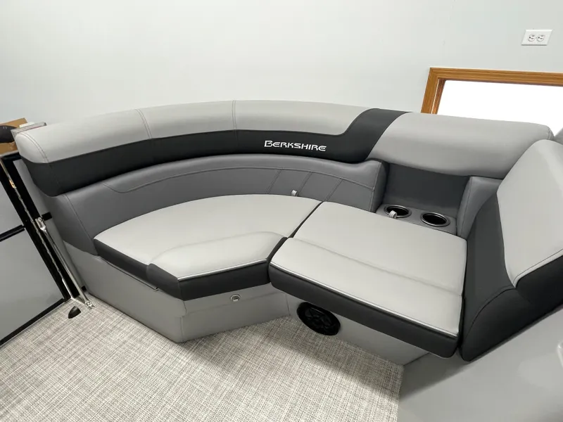 Slide: The Image of 2023 Berkshire 22RFX CTS boat interior with gray and black seating. - 5