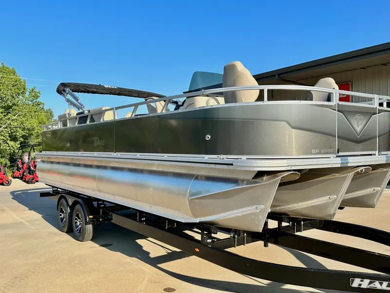 Slide: The Image of 2023 Tahoe Pontoon 25FT Sport 85 Center Console Fish boat on trailer. - 2