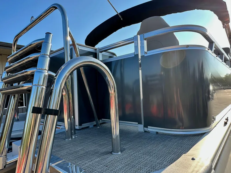 Slide: The Image of 2023 Tahoe Pontoon 25FT Sport 85 Center Console Fish, rear view with stainless steel ladder. - 5